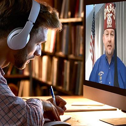 Man with headphones on watching video