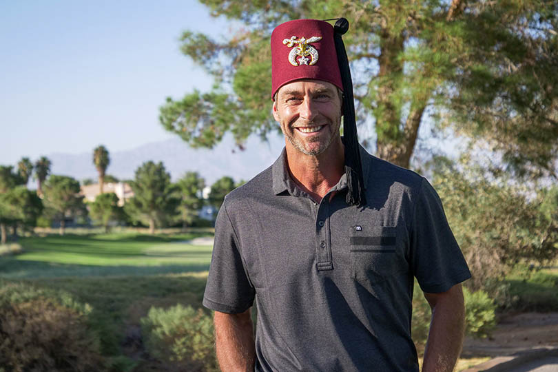 Shriner standing at golf course