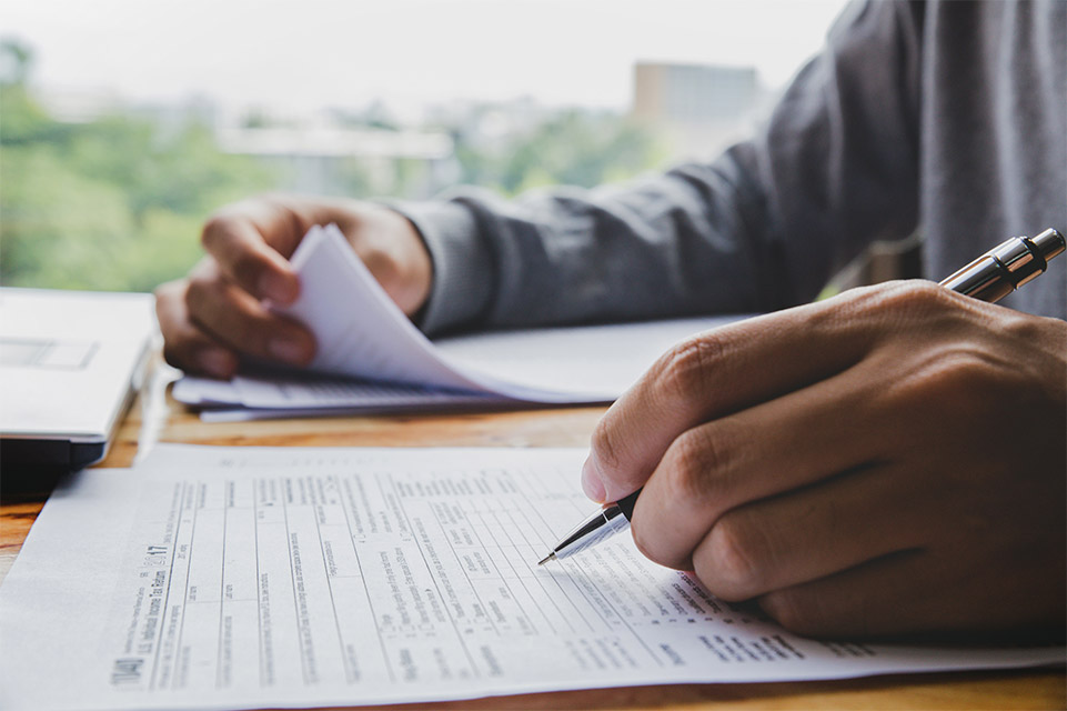 man filling out forms