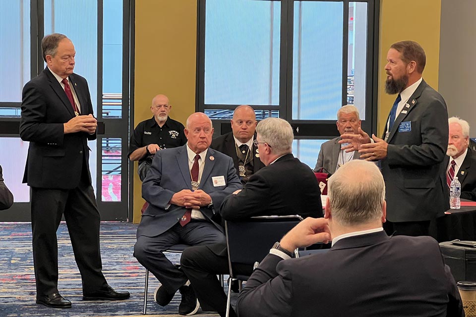 men wearing suits during discussion