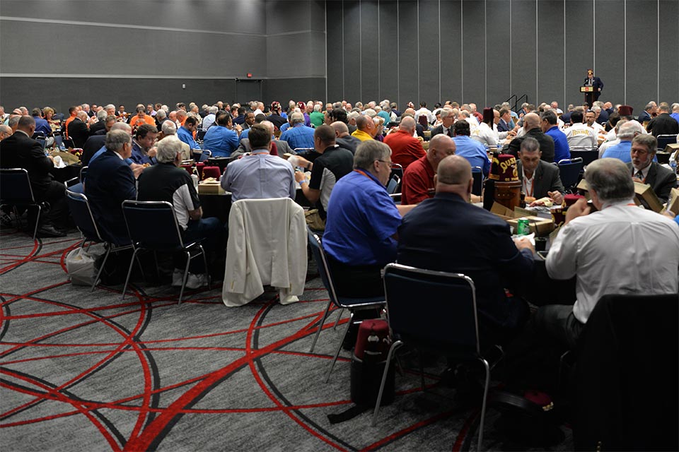 large group of seated luncheon attendees