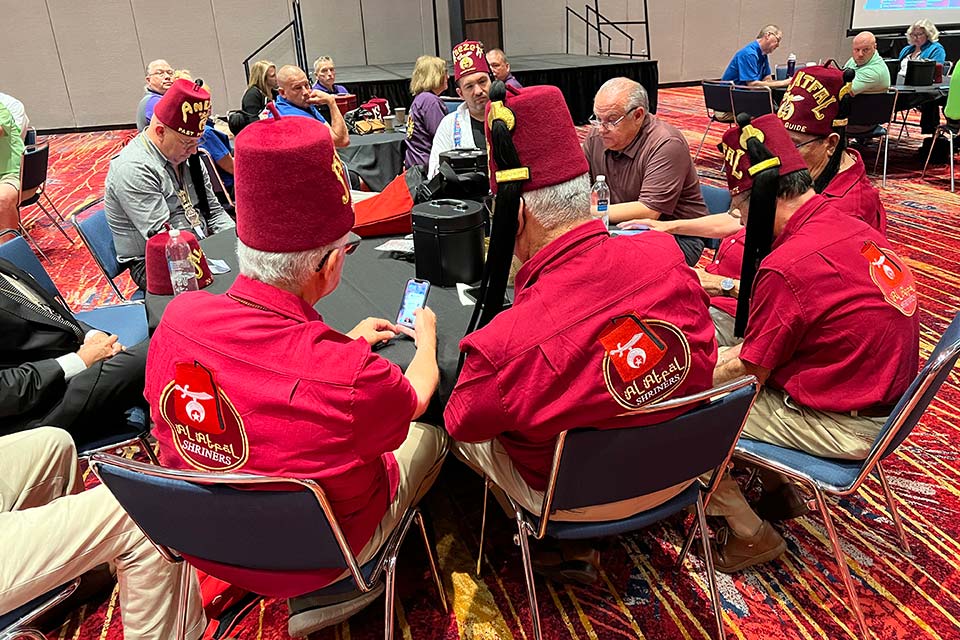 Shriners sitting at large round table