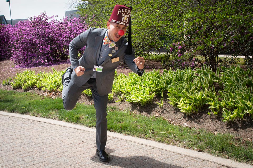 Hernandez clowning around, being silly while wearing clown nose