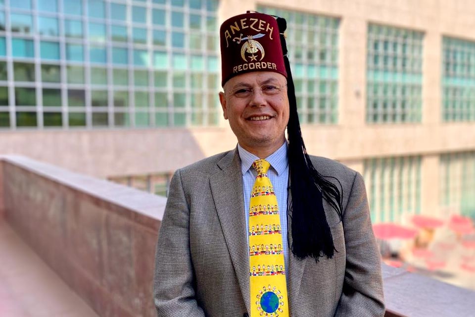 Aguayo wearing fez