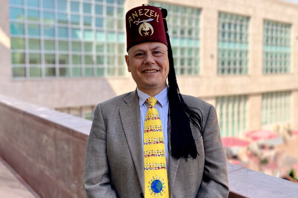 Aguayo wearing fez