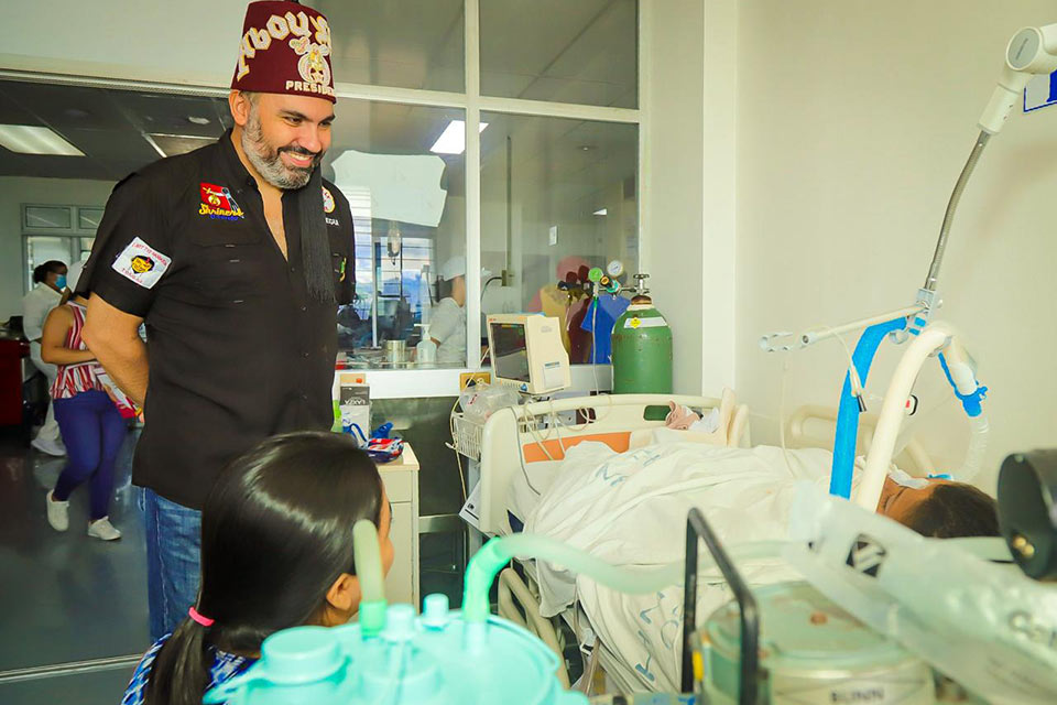 Shriner and patient in hospital