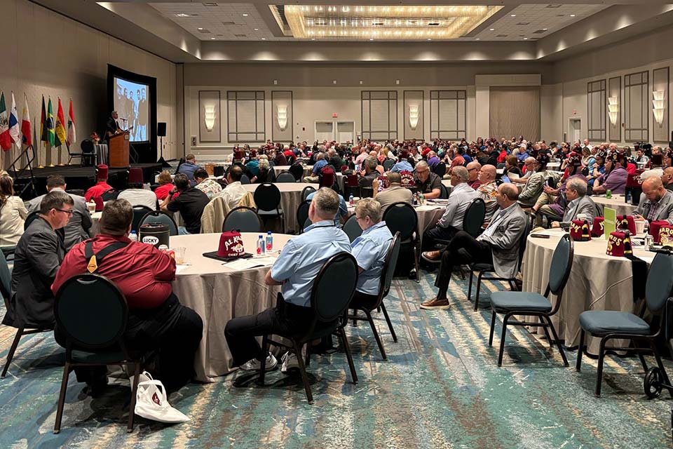 group seated during large conference