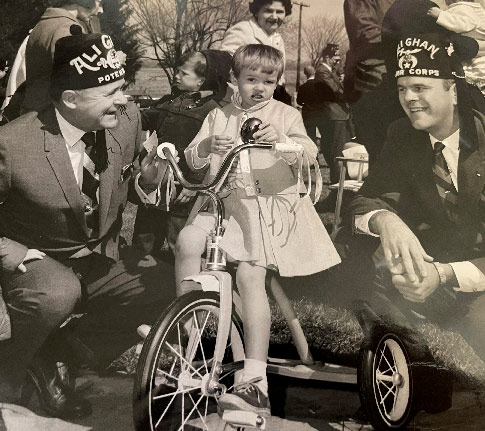 black and white image of shriner with son