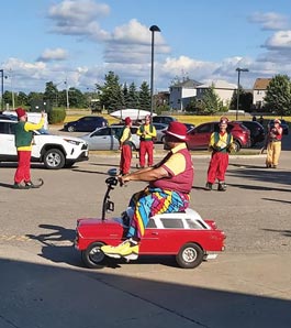 Shriner driving tiny car