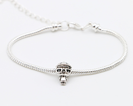 through the eyes of a child bead (child wearing glasses) on a silver bracelet