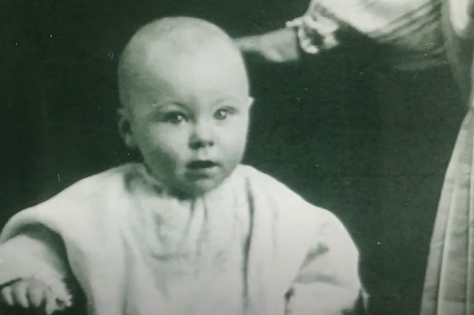 Black and white photo of a baby girl