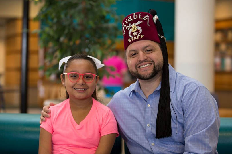 Shriners with patient sitting