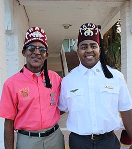 two shriners stand together as brothers