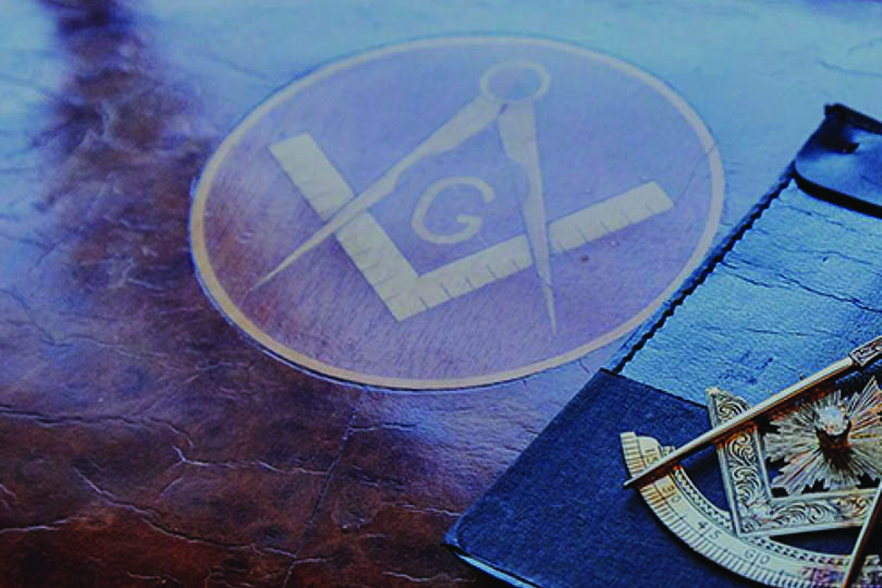 freemason square and compass on leather